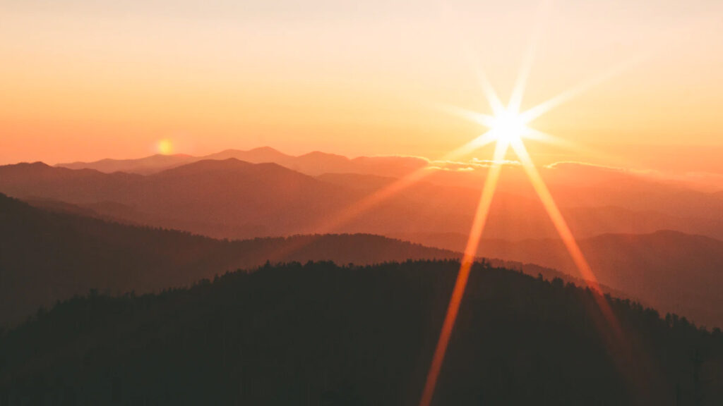 Sun setting on the mountain horizon